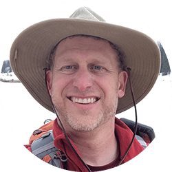 Profile photo of Shea Oliver in a hiking hat